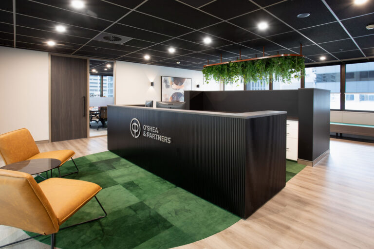 Reception area and desk with an O'Shea and Partners logo