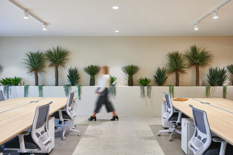 woman walking through office space