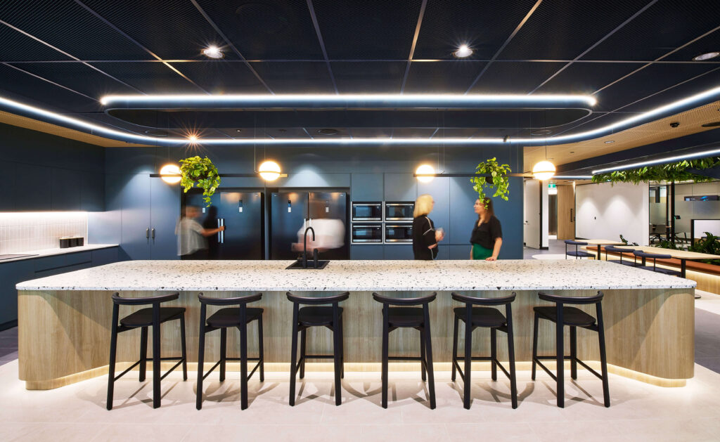 Modern Office suite open kitchen with island bench seating, with open dining tables