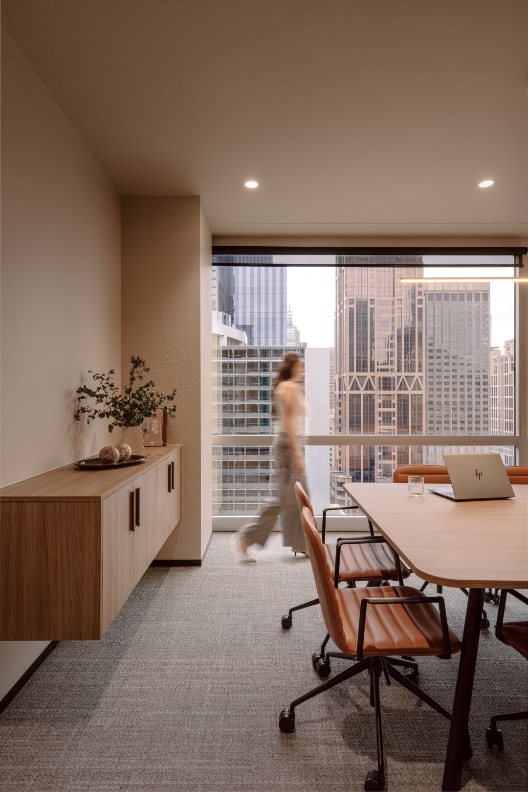 boardroom woman walking in background